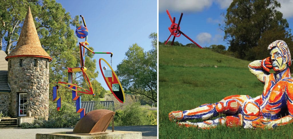 A colorful sculpture at di Rosa | A multi-colored human figure statue reclines in a meadow