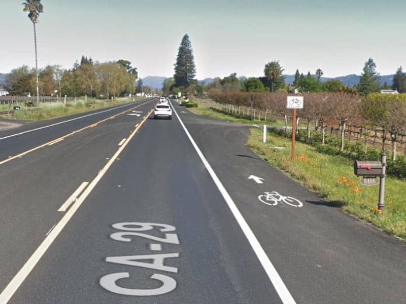 A view showing the bike lane adjacent to the traffic lane on highway 29 in Napa Valley.