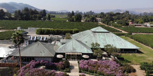 Aerial view of Laird Family Estate. Three pyramid shaped roofs surrounded by vineyards.