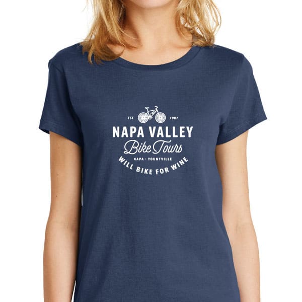 A woman wearing a navy shortsleeve tshirt with Napa Valley Bike Tours logo